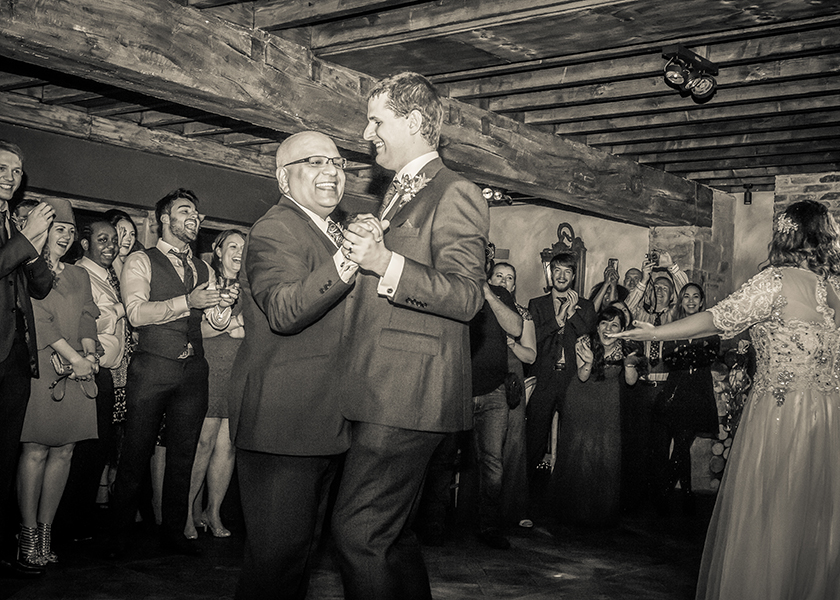 groom and father bride dancing