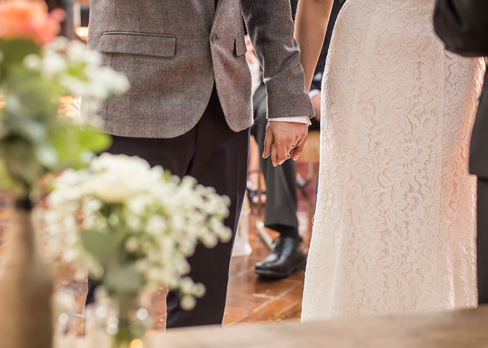 bride groom holding hands