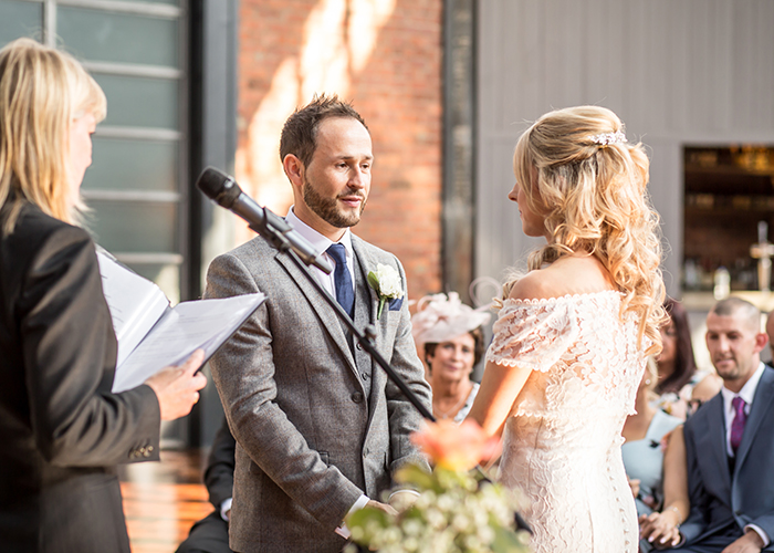 bride and groom saying vows