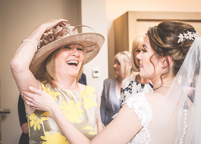 guest laughing with bride