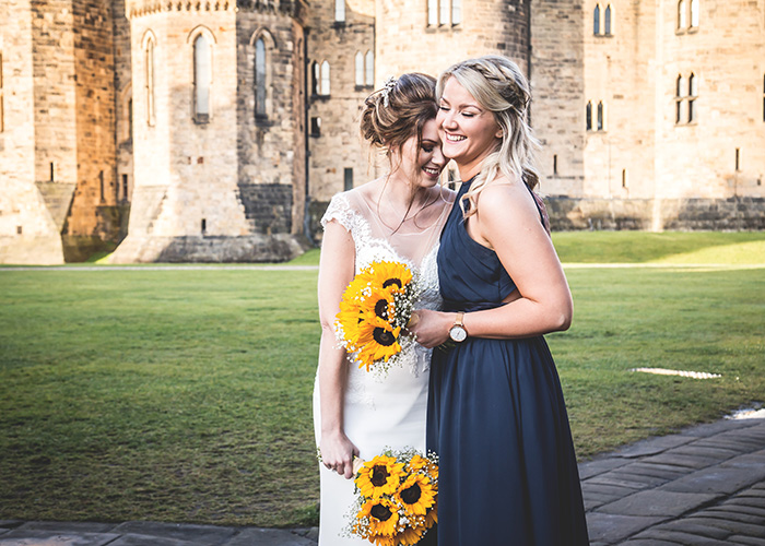 bride and bridesmaid laughing