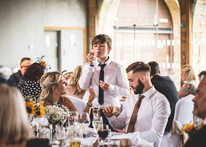 blowing bubbles at wedding reception