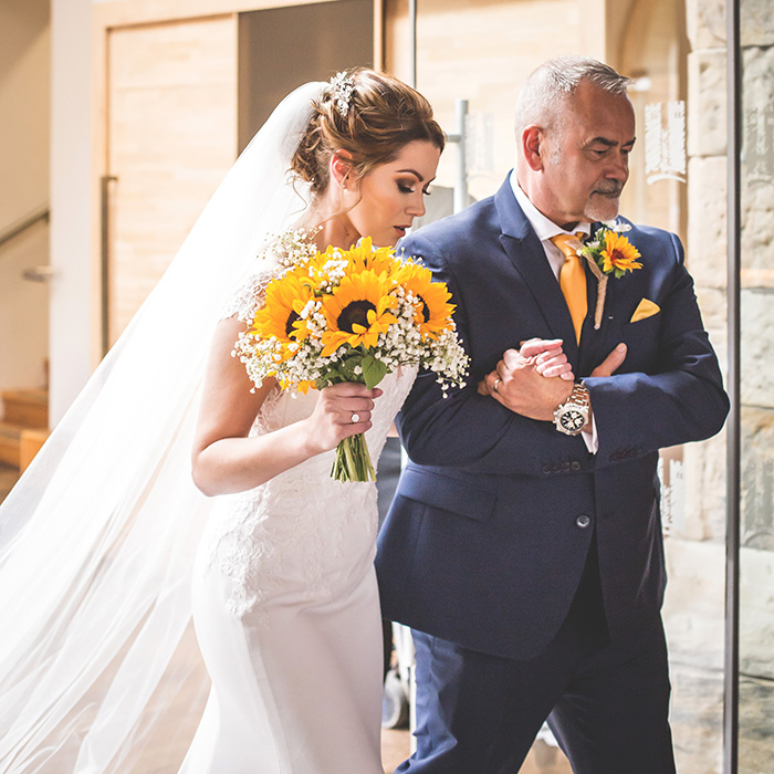 bride arriving with her father