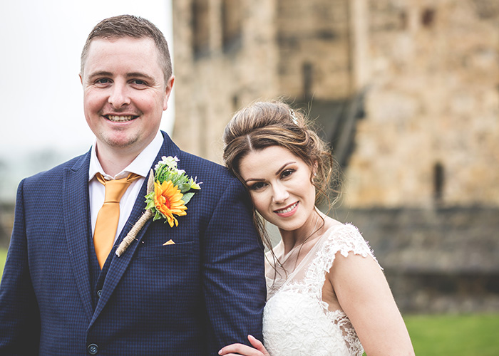 bride head on grooms shoulder