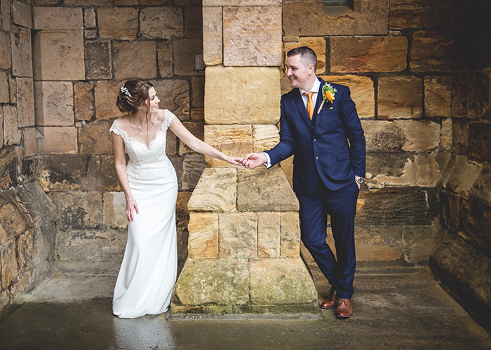 bride and groom having fun while taking photos