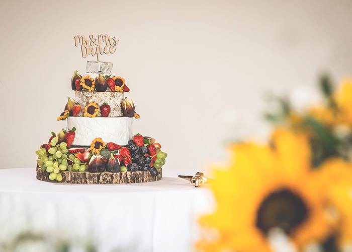 cheese cake with sunflowers in foreground