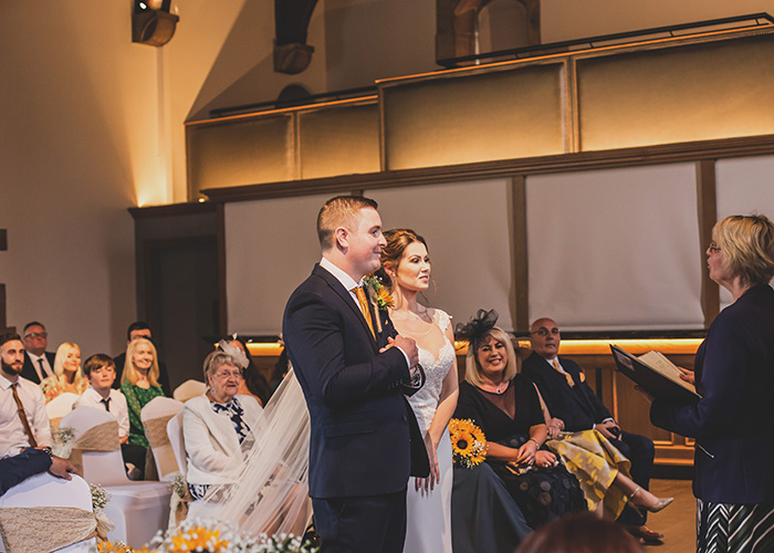 holding hands during wedding ceremony