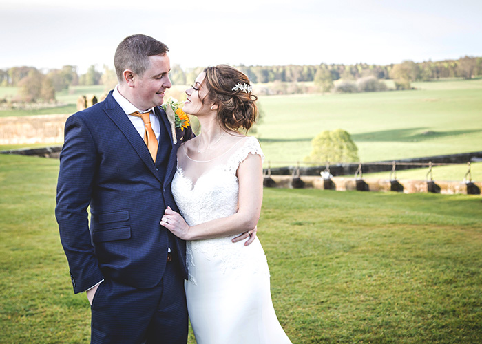 bride groom overlooking alnwick pastures